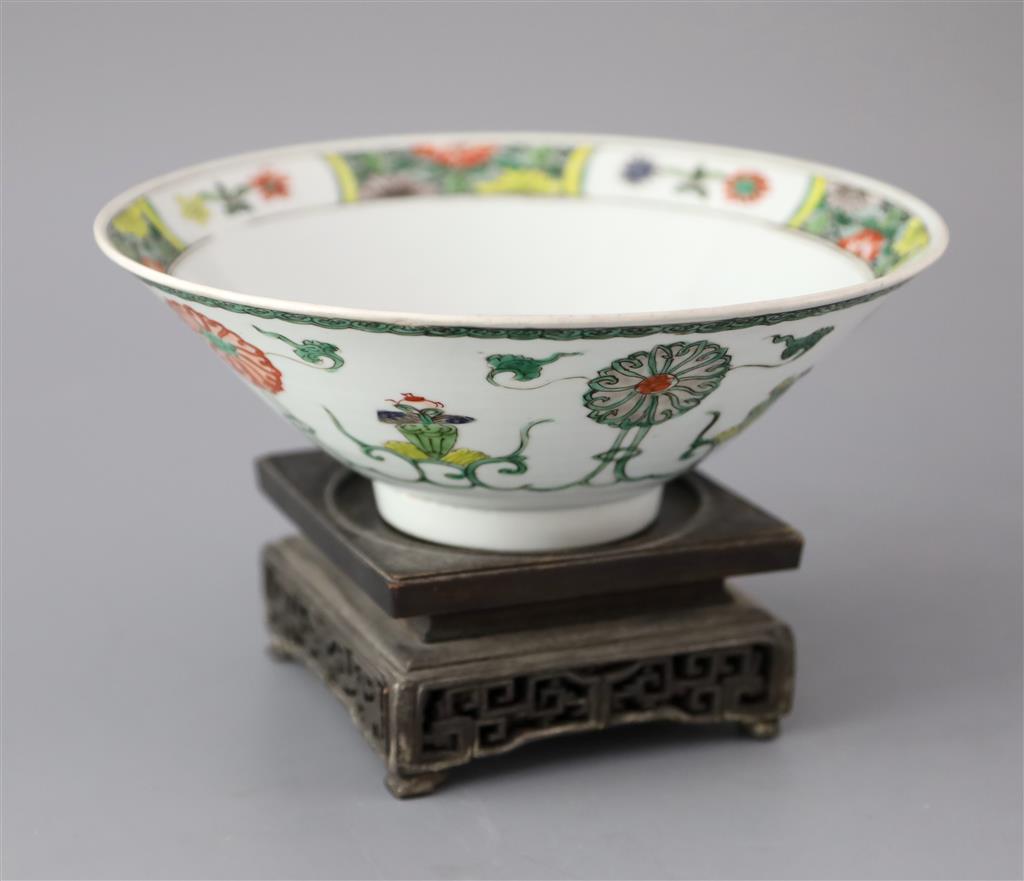 A Chinese famille verte conical shaped bowl, Kangxi period, 20.5cm diameter, ebonised wood stand